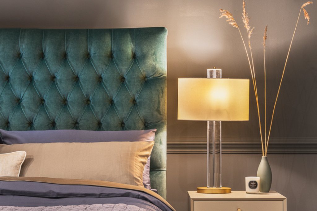 And So To Bed Emilia Grand Bed headboard beside a bedside lamp and table