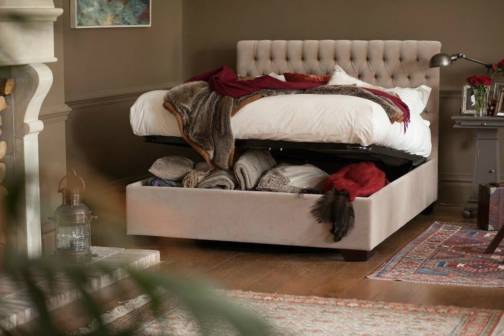 And So To Bed Emilia Ottoman Bed in stone fabric with storage open and blankets inside