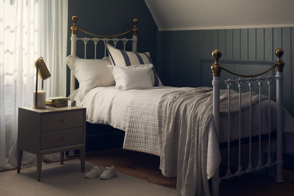 And So To Bed Juniper Bed as a single bed in an attic room with dark green panelling