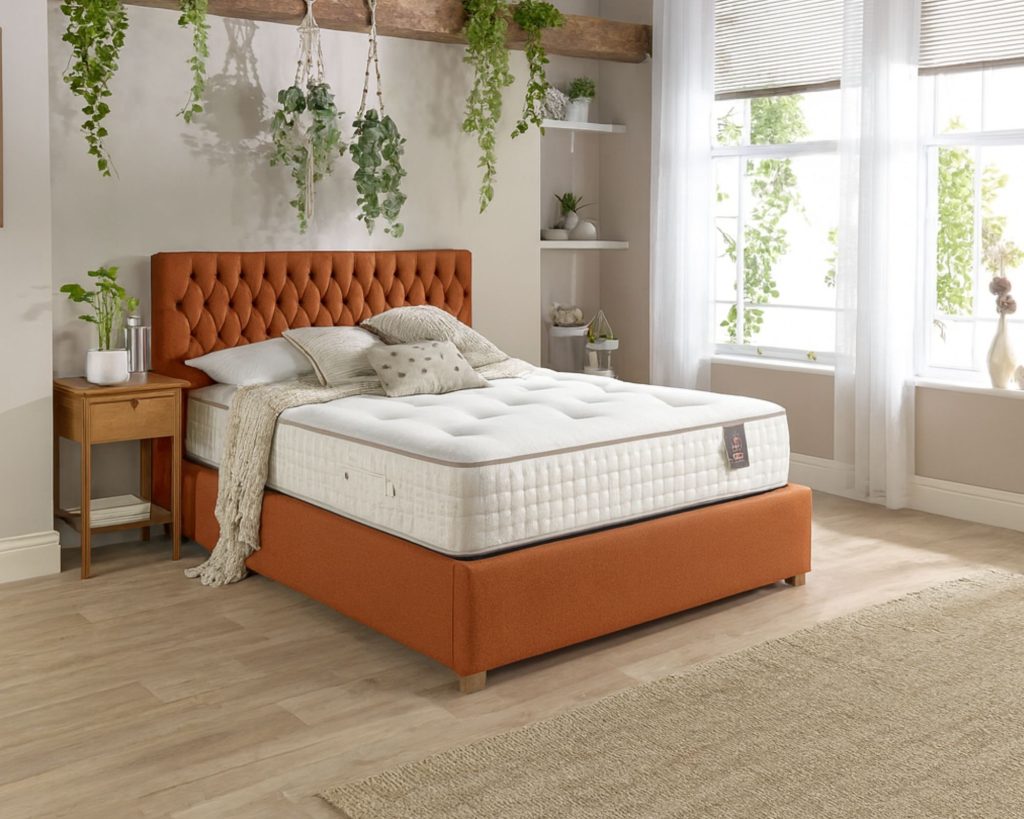 Aspire 5000 Pocket Wool Cashmere and Silk Dual Sided mattress on a rust velvet bed
