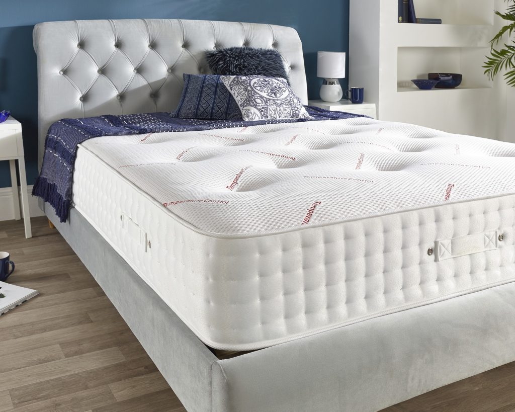 Aspire Advanced Temperature Control 1000 Pocket Dual Sided mattress on a grey velvet bed