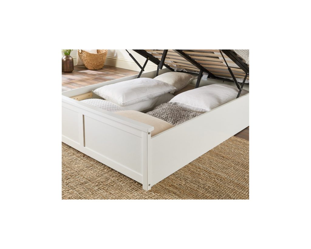 Aspire Atlantic Wooden Ottoman Bed in white, close-up of the open storage well with pillows