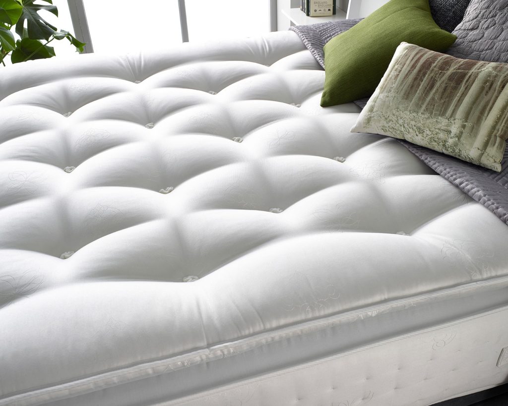 Aspire Cashmere 1000 Pocket Pillowtop, close-up of the hand-tufted pillow top