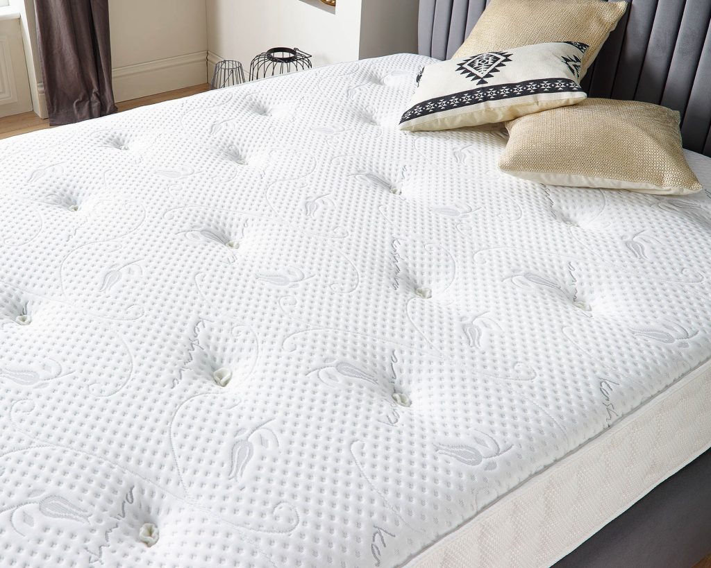 Aspire Cashmere 1000 Pocket+ Dual Sided mattress on a bed with cushions