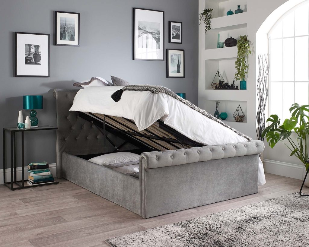 Aspire Scroll Top Chesterfield Ottoman Bed with the base lifted from the side