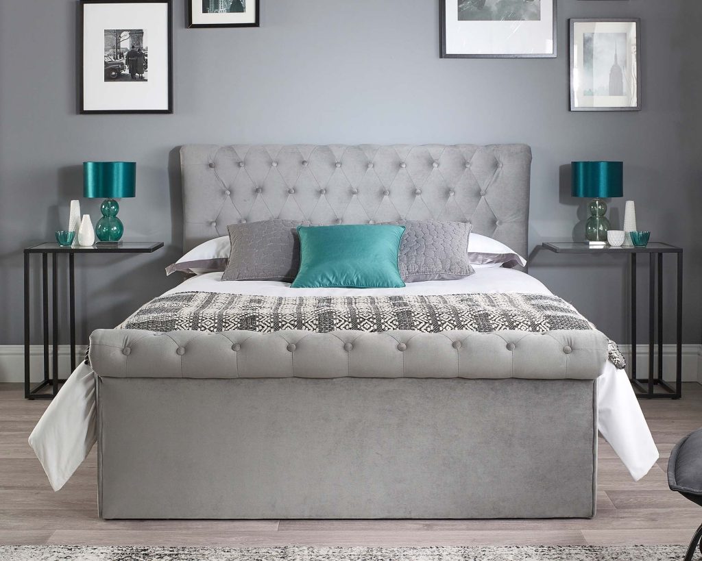 Aspire Scroll Top Chesterfield Ottoman Bed seen from the scrolled footboard end