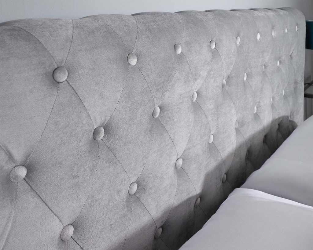 Aspire Scroll Top Chesterfield Ottoman Bed, deep-buttoned velvet headboard close-up