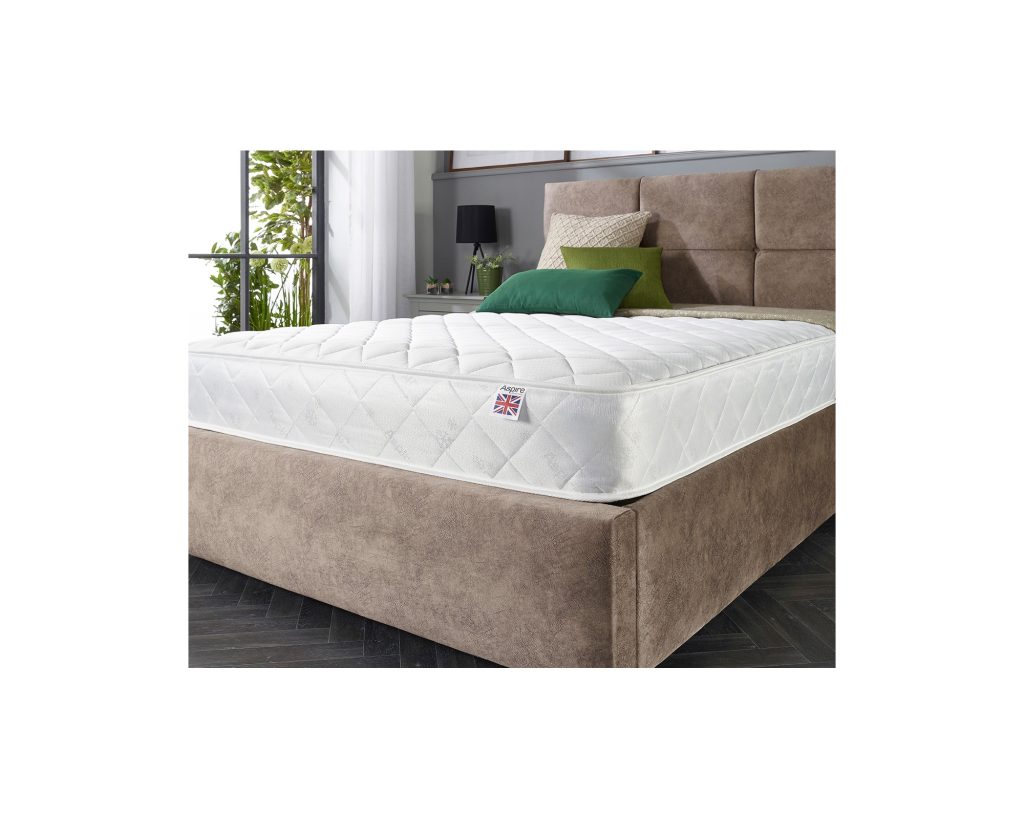 Aspire Comfort Rolled Mattress on an upholstered bed in a bedroom
