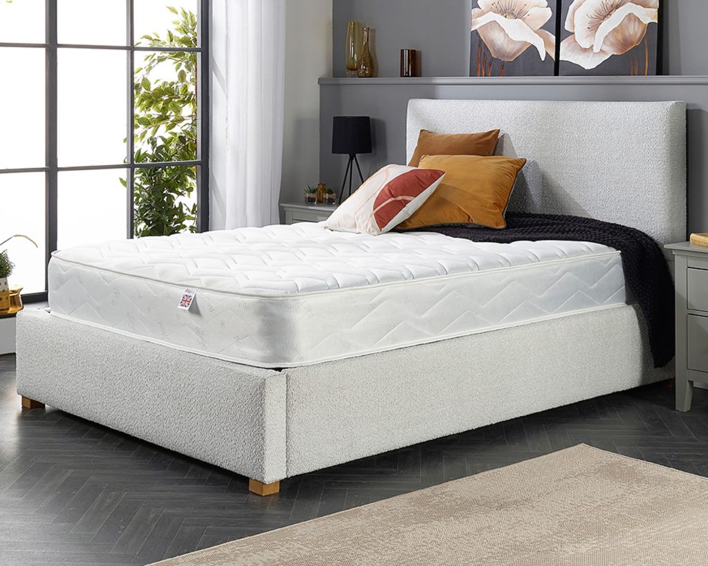 Aspire Double Comfort Memory Rolled Mattress in a grey bedroom, wide view