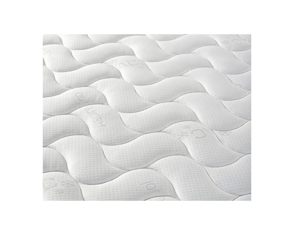 Close-up of the wave-quilted Cool Touch fabric on the Aspire Eco Foam Rolled Mattress