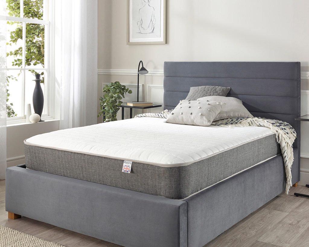 Aspire Pocket+ 3000 Memory Cooler Mattress on a grey upholstered bed