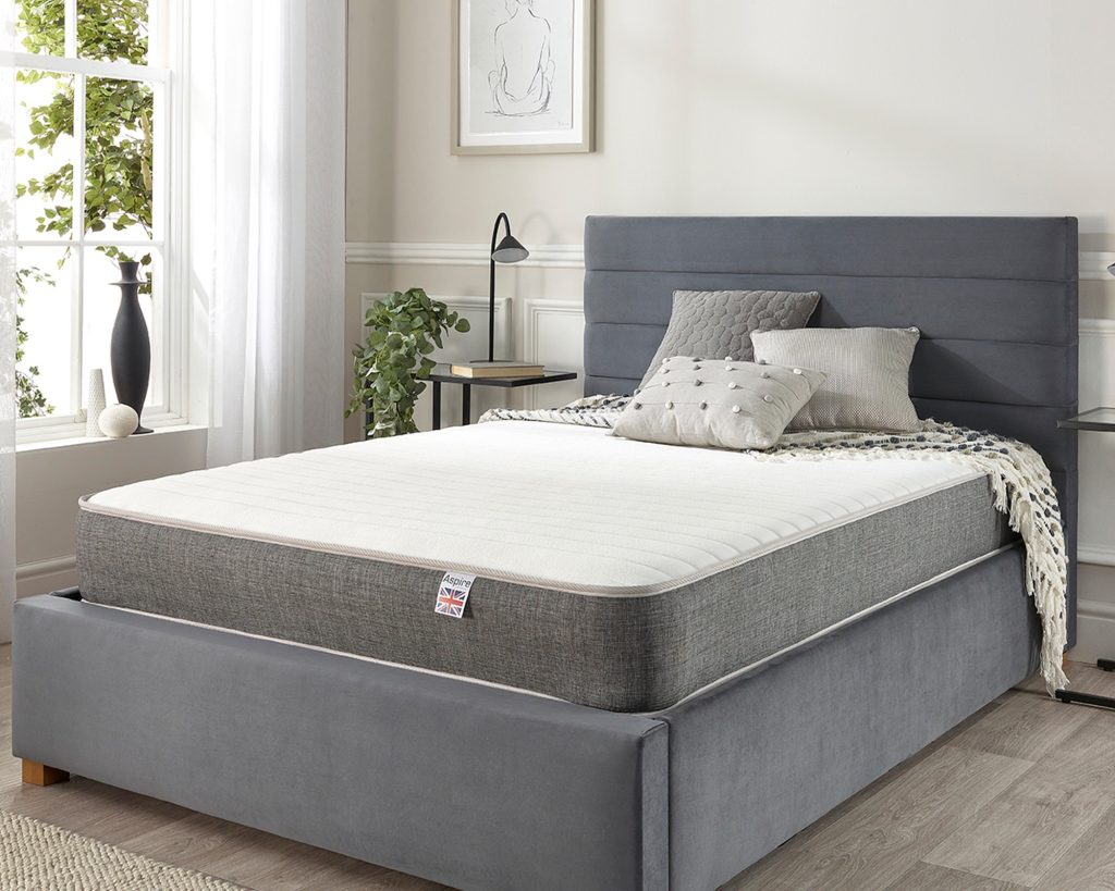 Aspire Pocket+ 3000 Memory Mattress on a grey upholstered bed