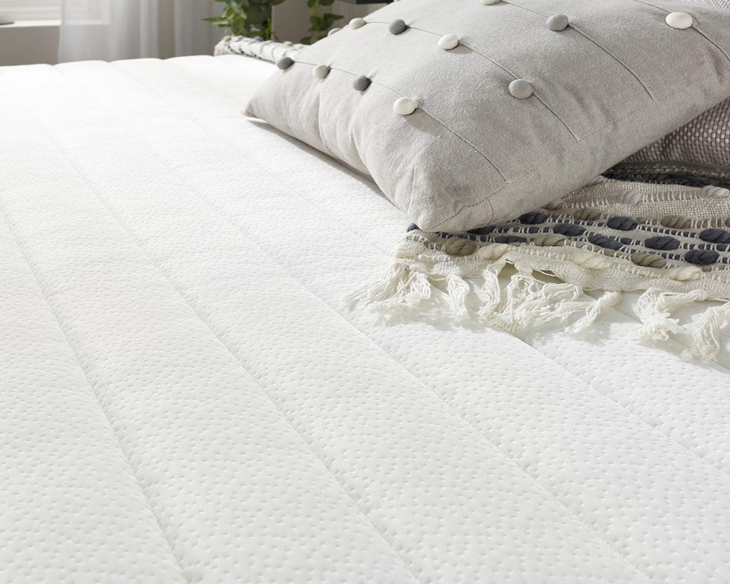 Close-up of the quilted Pisa fabric on the Aspire Pocket+ 3000 Memory Mattress