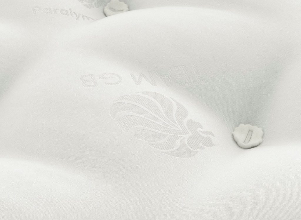 Close-up of the tufted natural cover of the Dream Team Ashbourne mattress