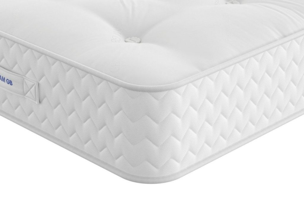 Corner of the Dream Team Fakenham mattress with its quilted damask border