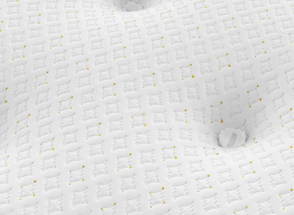 Close-up of the CopperLeaf knitted cover and tufting on the Dream Team Gold Lynmouth