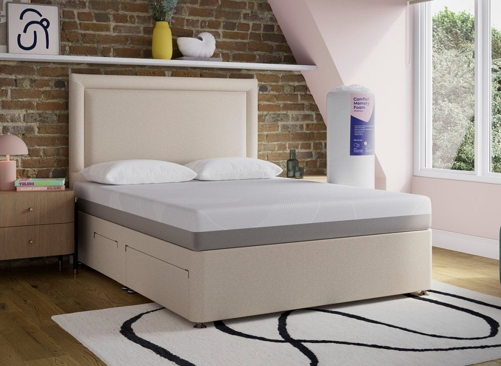 Dreams Comfort memory foam mattress on a cream divan bed, with the rolled box beside it