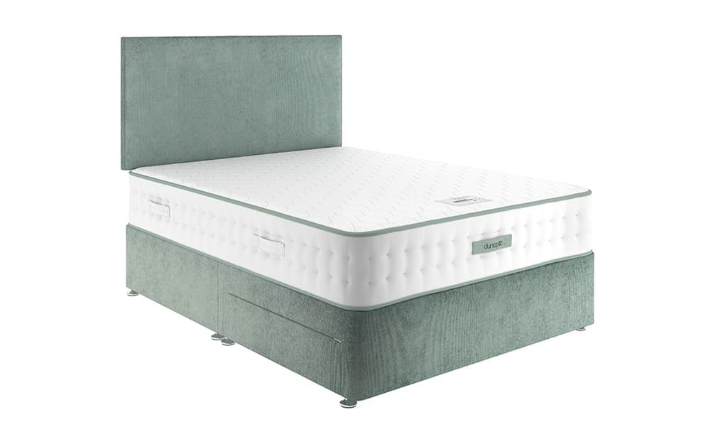 Dunlopillo Meya mattress on a green divan with headboard