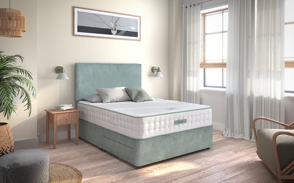 Dunlopillo Meya mattress on a green divan bed in a bedroom