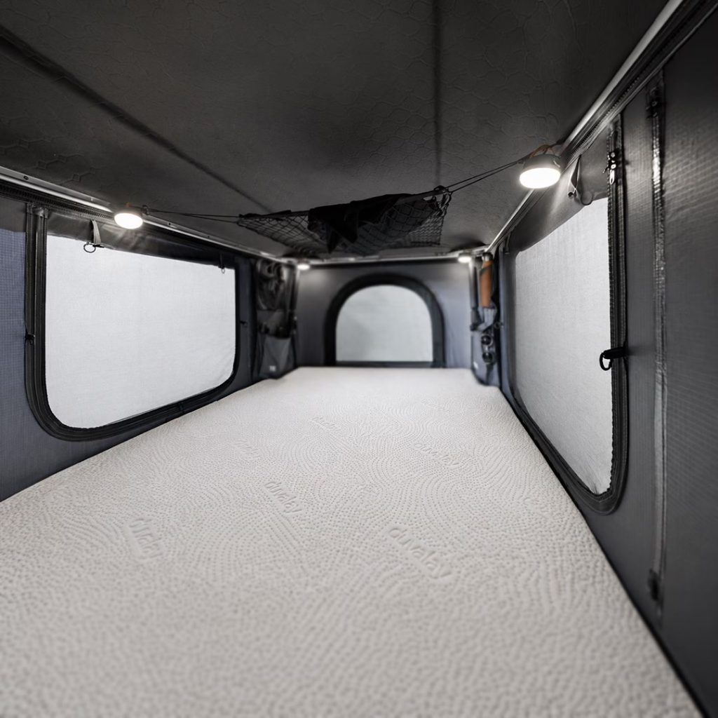 Duvalay roof tent mattress topper inside a TentBox Classic
