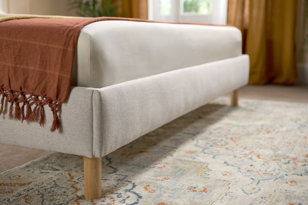 Emma Box Bed foot end with rounded upholstered frame and rubber wood legs