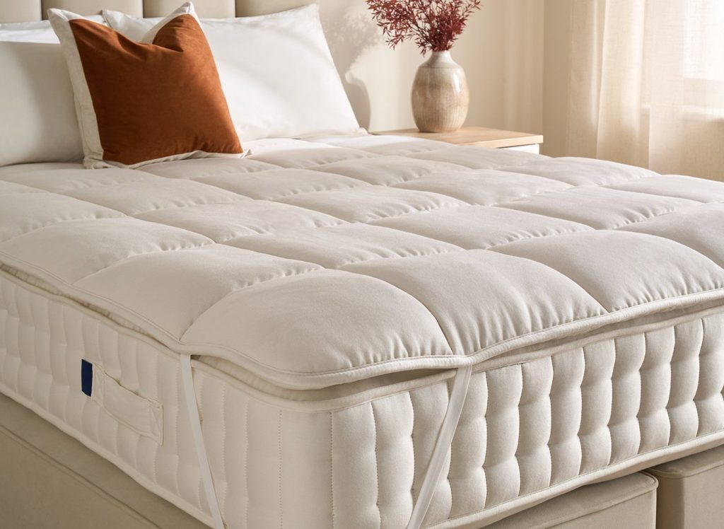 Flaxby Quilted Wool Mattress Enhancer fitted on a pocket-sprung mattress