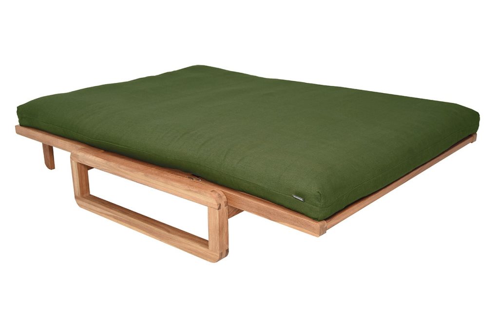 Futon Company Authentic futon in a forest green cover laid flat as a bed