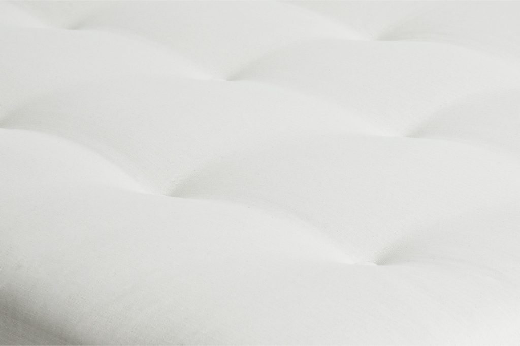 Close-up of the tufted natural cotton surface of the Futon Company Supreme Bifold futon