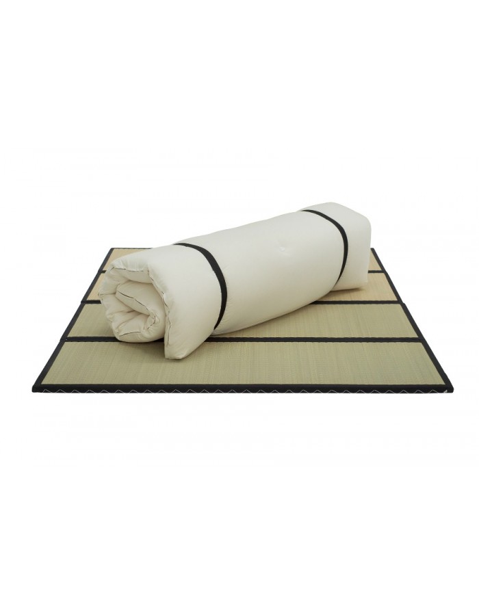Futons247 Monk bed roll in natural cotton drill rolled with black straps on tatami