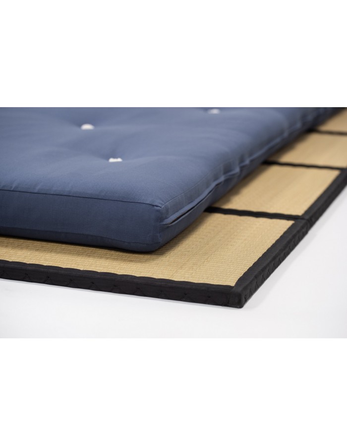Close-up of the Futons247 Neru bed roll edge, felt tufts and cotton fabric
