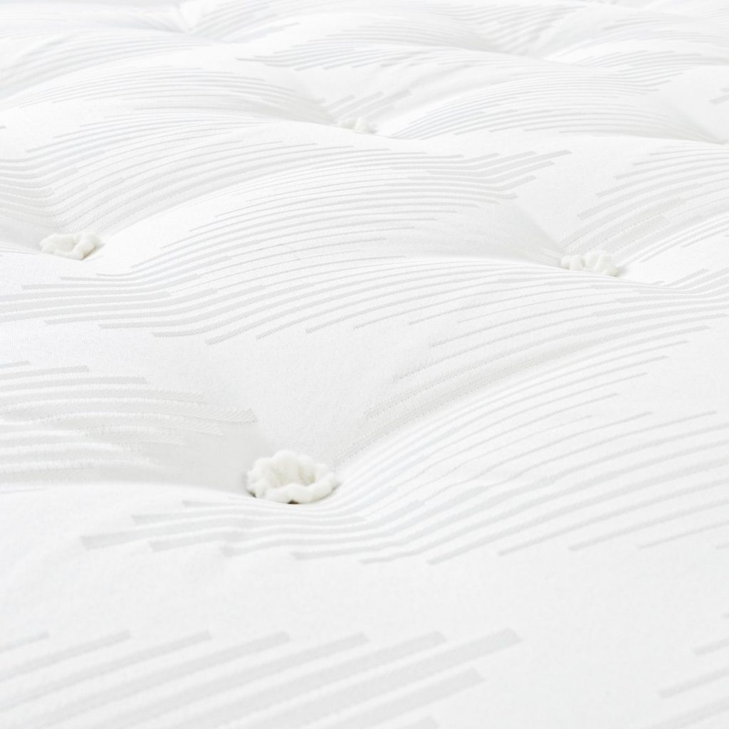 Habitat Ari Natural 1000 Pocket Comfort mattress, close-up of the tufted sleep surface