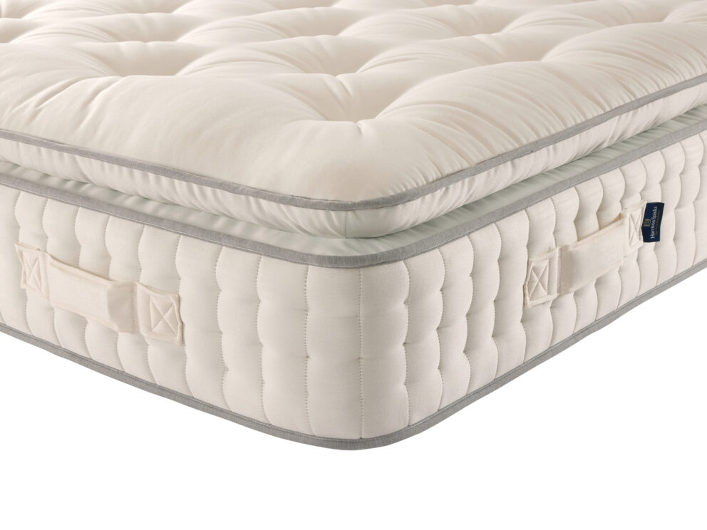 Corner of the Harrison Spinks Radiant Pillowtop 15000 showing the attached pillow top