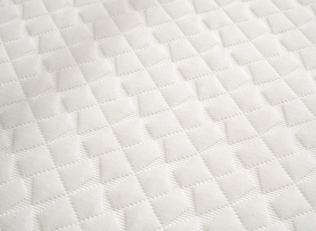 Close-up of the quilted cover fabric of the Hyde & Sleep Memory Foam Mattress Topper