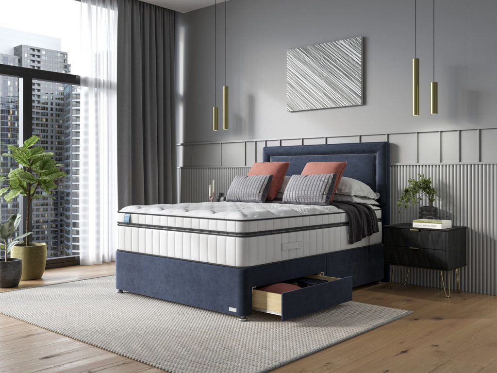 iGel NanoTech 6000i Plushtop on a navy divan bed in a city-view bedroom