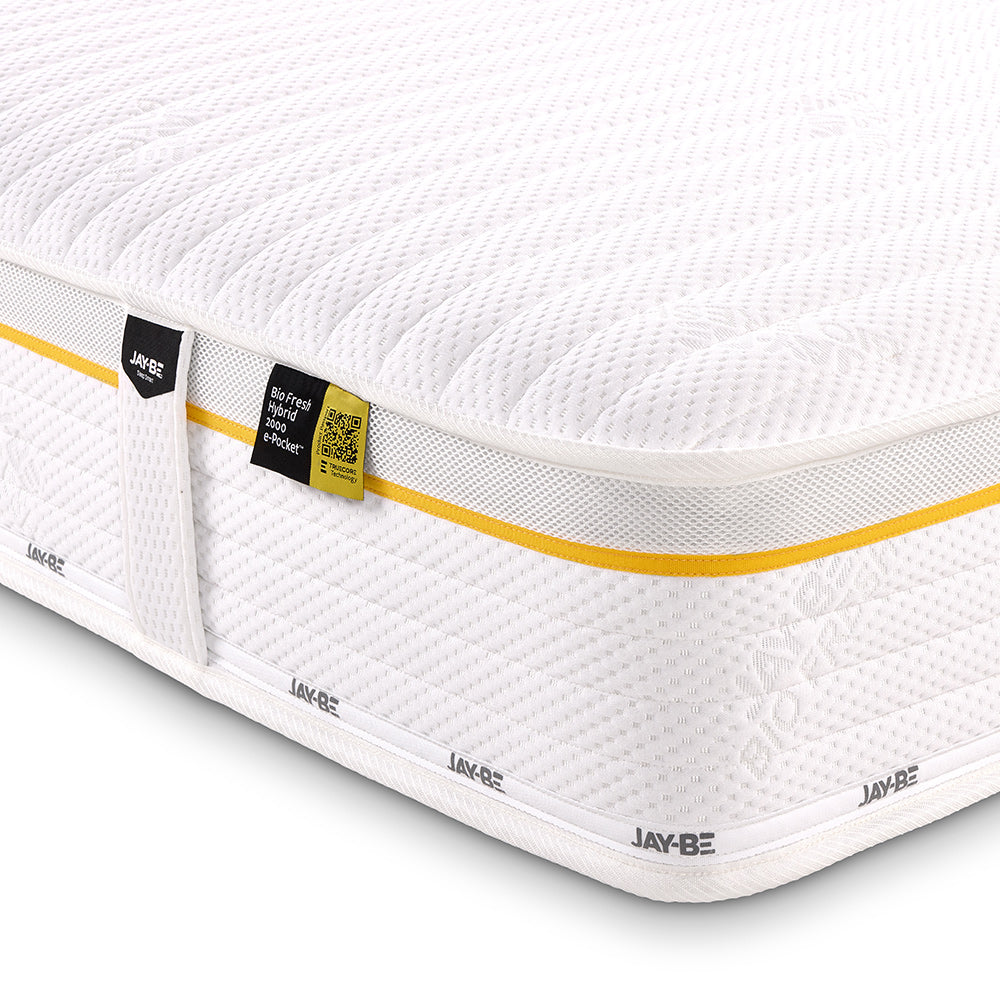 Jay-Be Bio Fresh Hybrid 2000, close-up of the knitted cover, yellow piping and label