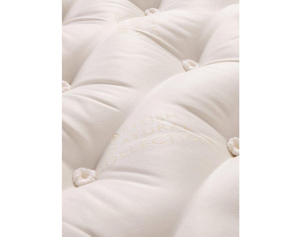 Close-up of the wool rosettes on the Helmsley Wool Pillowtop surface