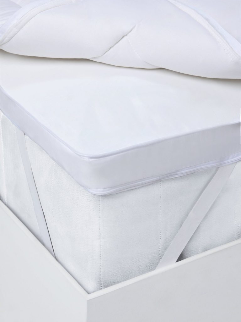 John Lewis Specialist Support Ultimate Dual Layer topper strapped to a mattress, corner view