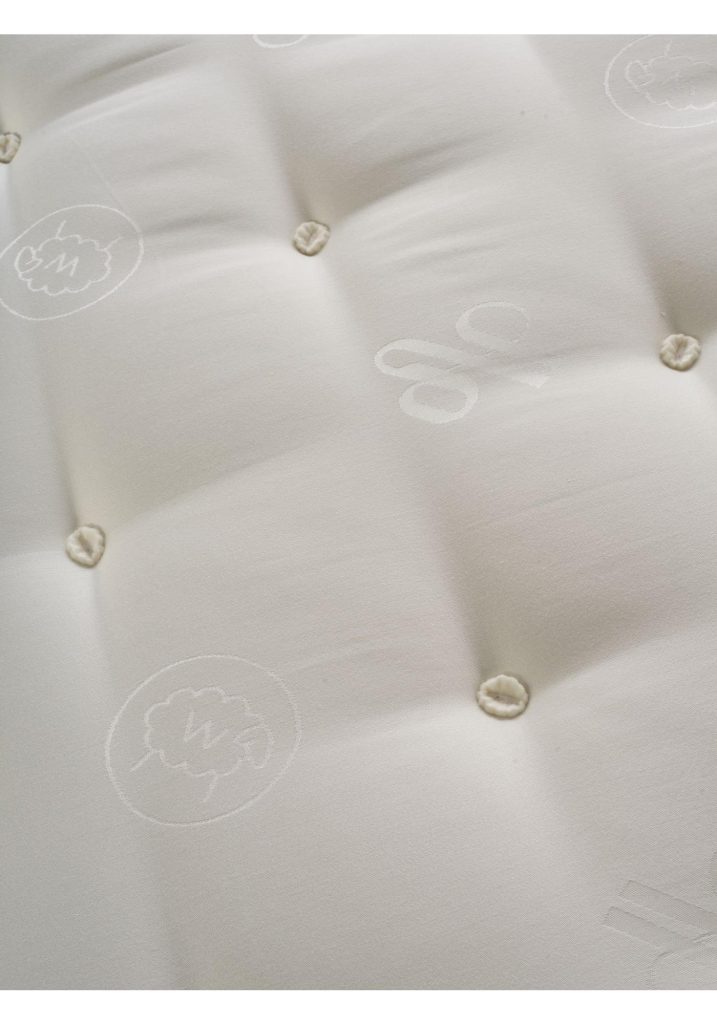 Tufted sleep surface of the Waitrose Wool 1600 with the sheep motif fabric