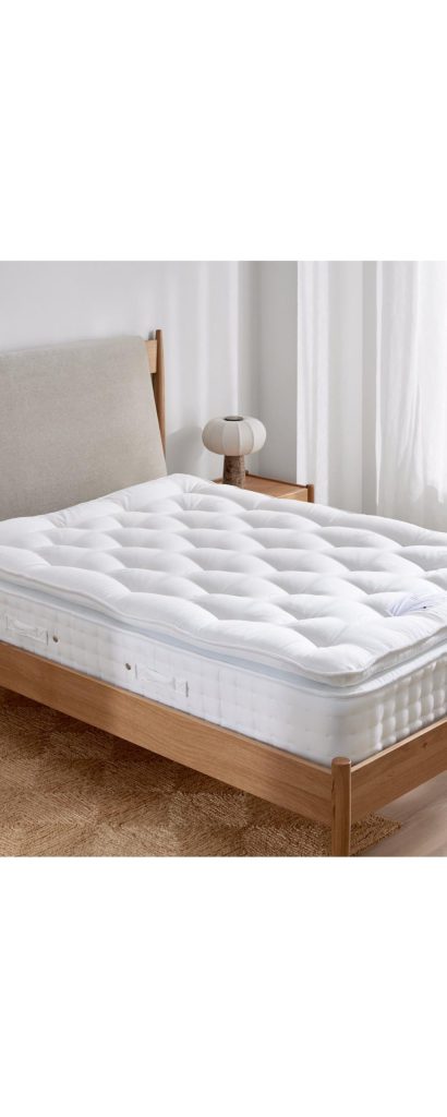 Waitrose Wool 1800 Pillowtop mattress on a wooden bed frame in a bedroom