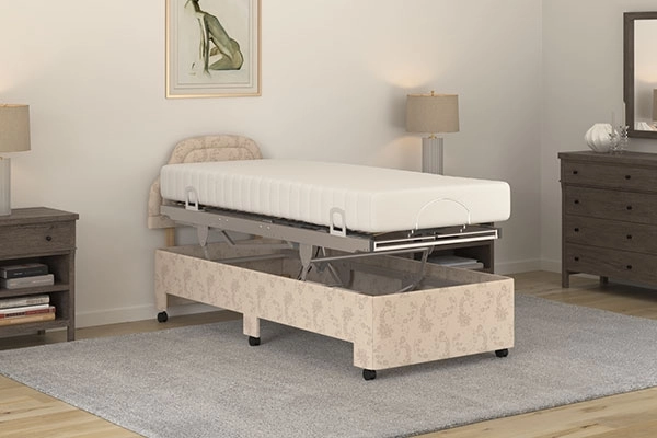 Laybrook Lewes care bed raised flat on its vertical lifting frame to carer height