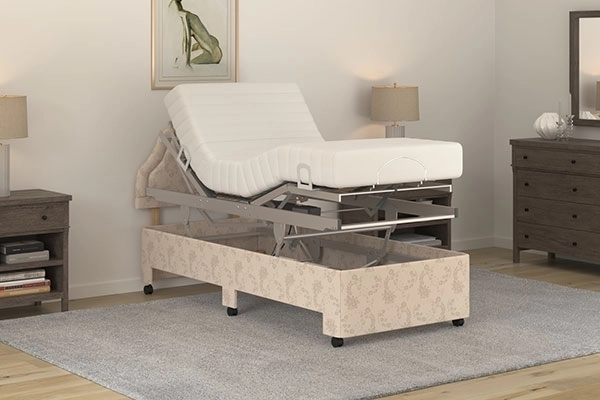 Laybrook Lewes care bed lifted on its frame with head and foot profiled