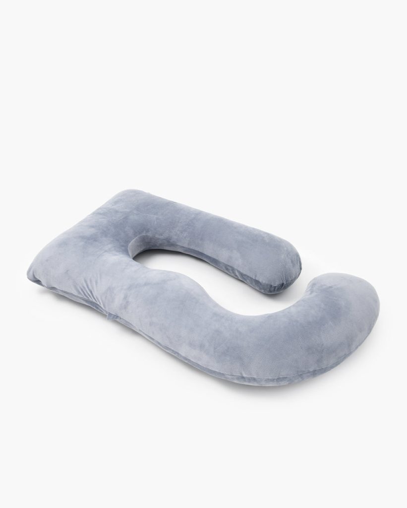 Momcozy Huggable U-shaped pillow seen from an angle, showing its curved legs