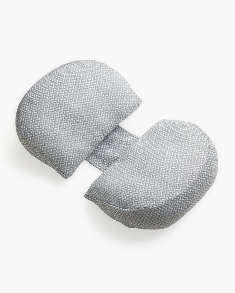 Momcozy pregnancy wedge pillow seen from an angle, showing the two sloped cushions