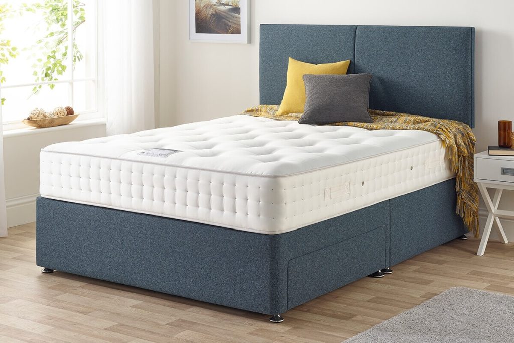 Relyon Guildford 1000 mattress on a blue divan bed in a bedroom