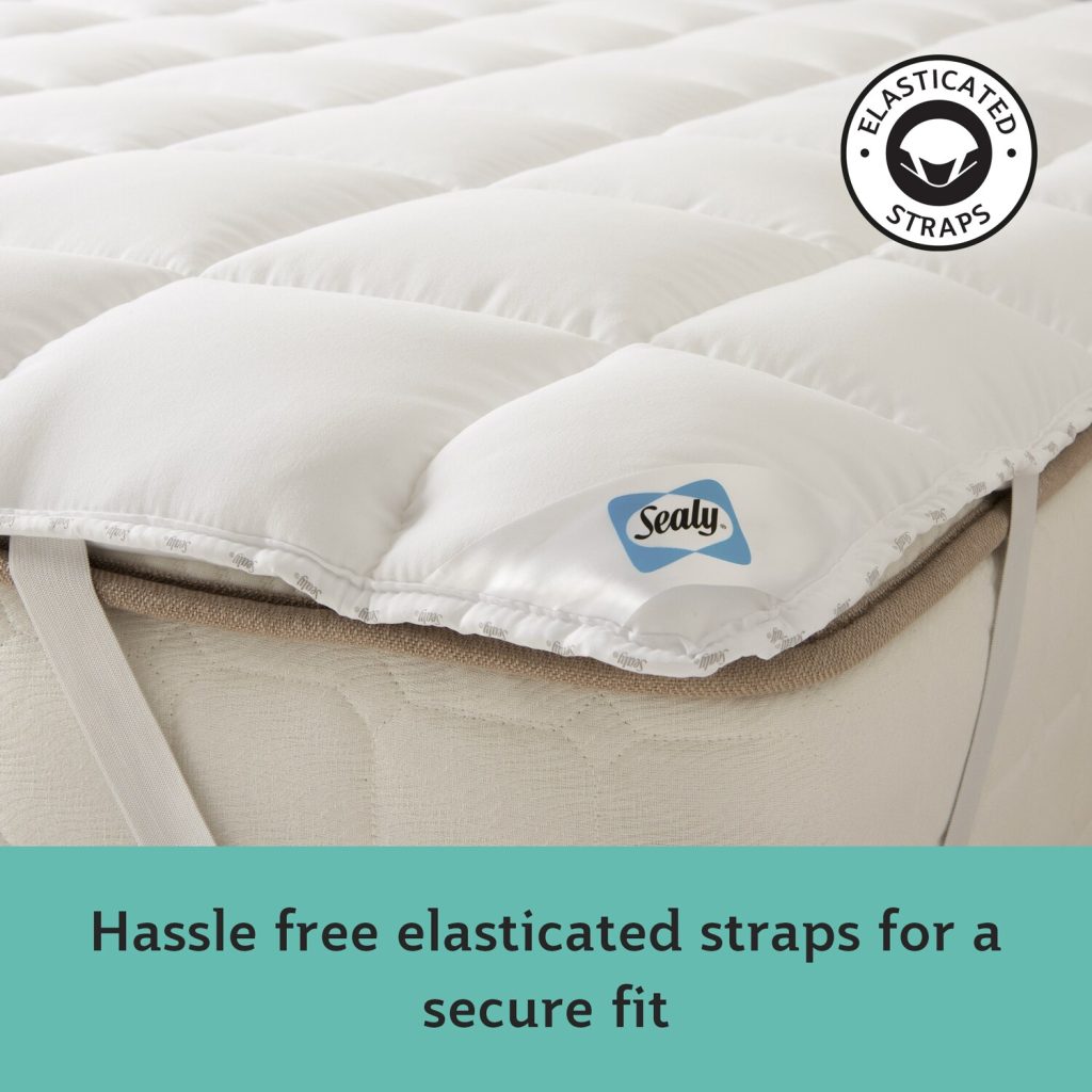 Corner of the Sealy Anti-Allergy topper with its elasticated strap and label