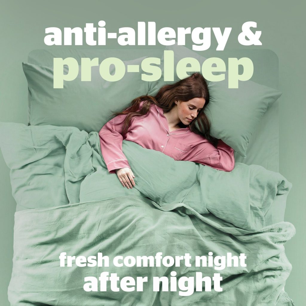 Woman sleeping in a bed fitted with the Silentnight Anti-Allergy Ultimate topper