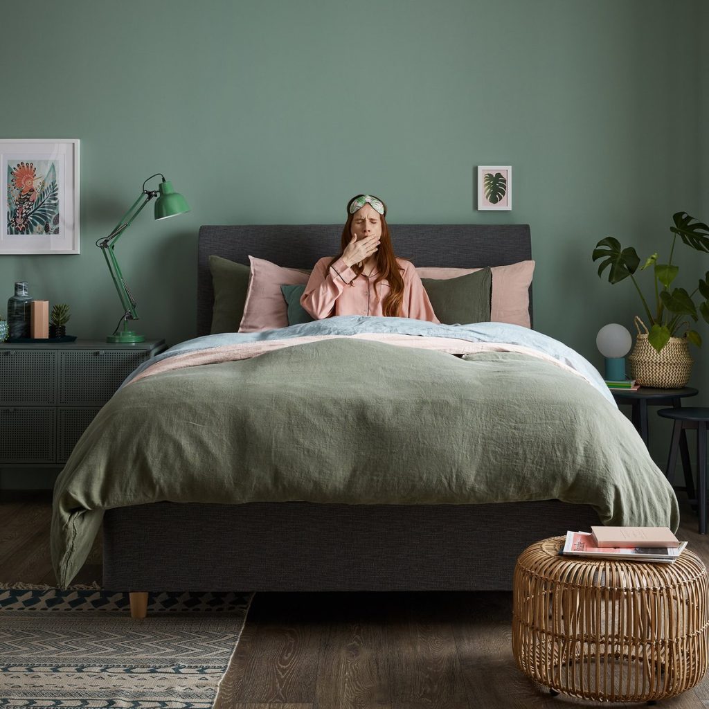 Silentnight Ashford 1400 Pocket Ortho mattress made up on a bed in a green bedroom