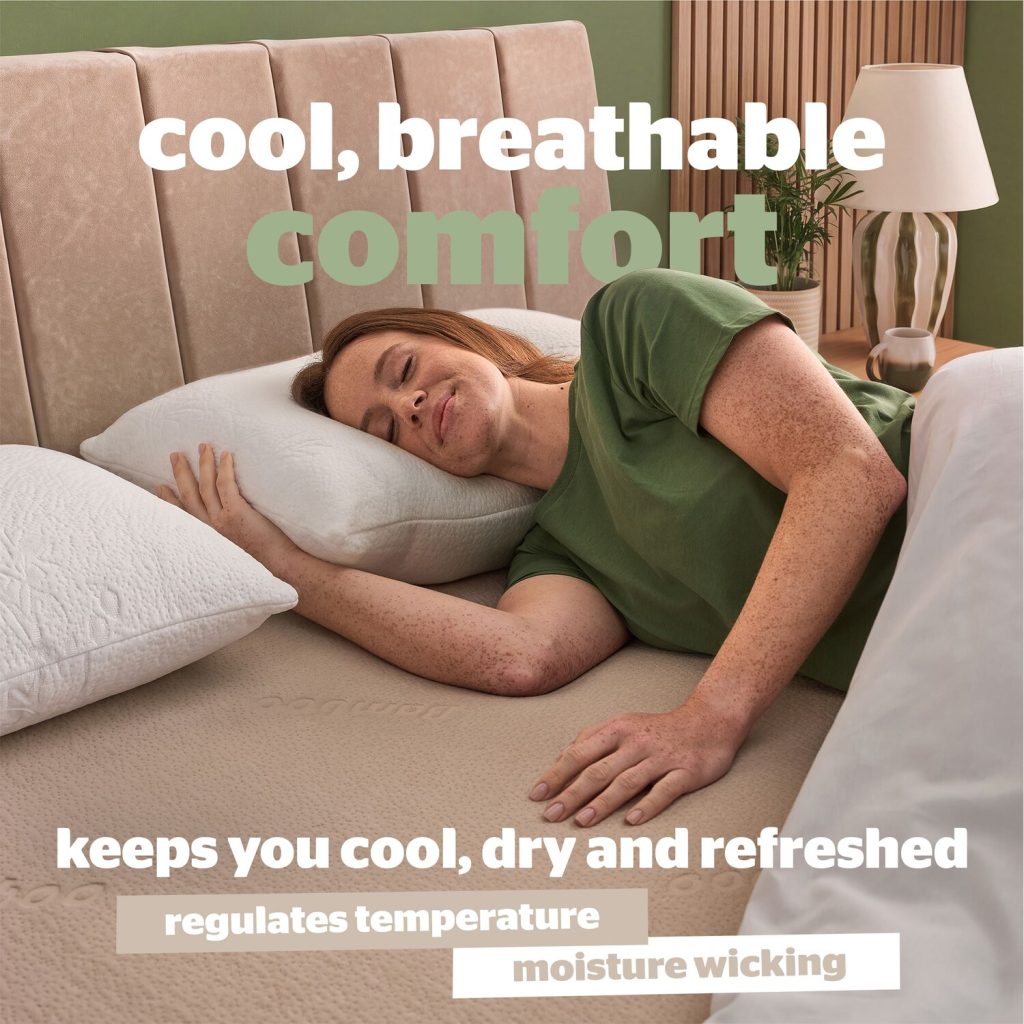 Woman resting on a pillow on the Silentnight Bamboo Memory Foam topper