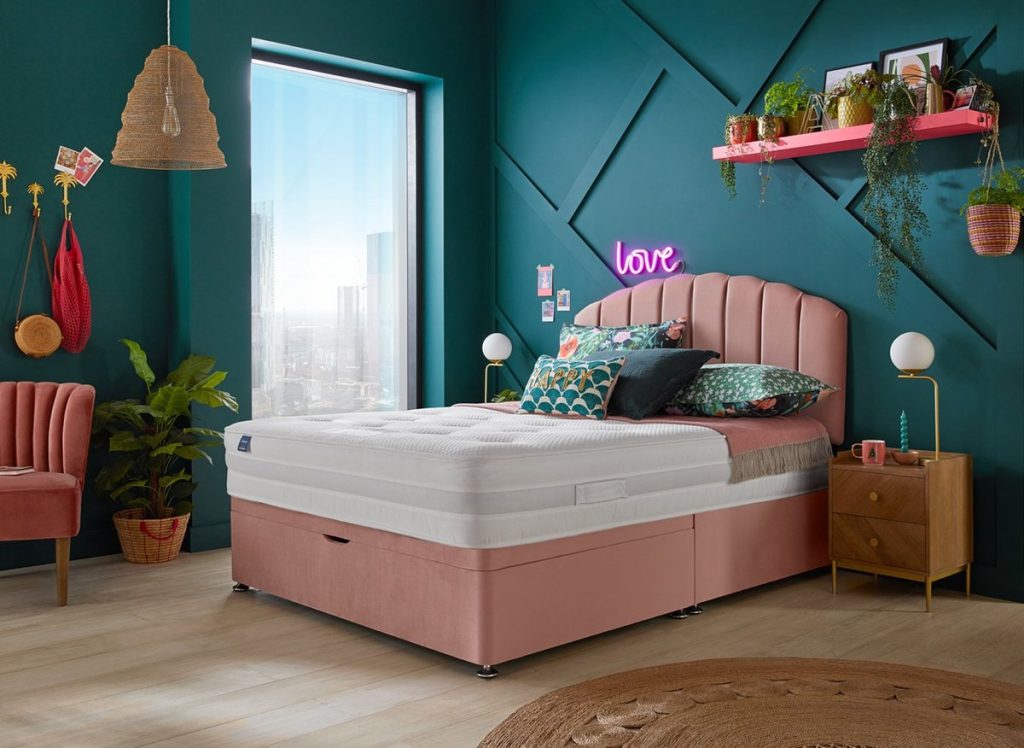 Silentnight Melrose mattress on a pink divan bed in a green-walled bedroom