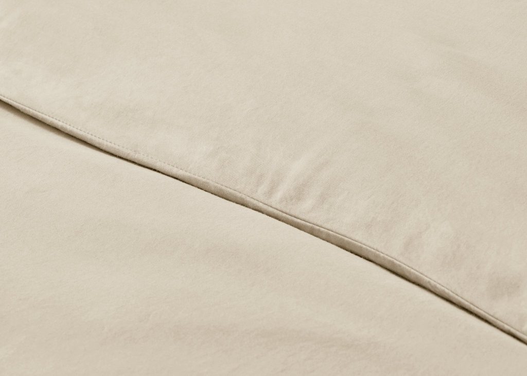 Simba Brushed Tencel Duvet Cover on a made bed, close view of the fabric